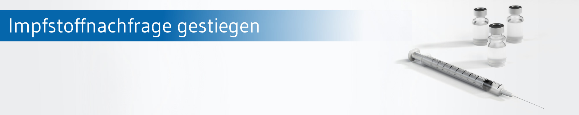 Spritze und Impfstoffampullen neben dem Text 'Impfstoffnachfrage gestiegen'.
